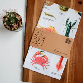 sea life tea towel in packaging